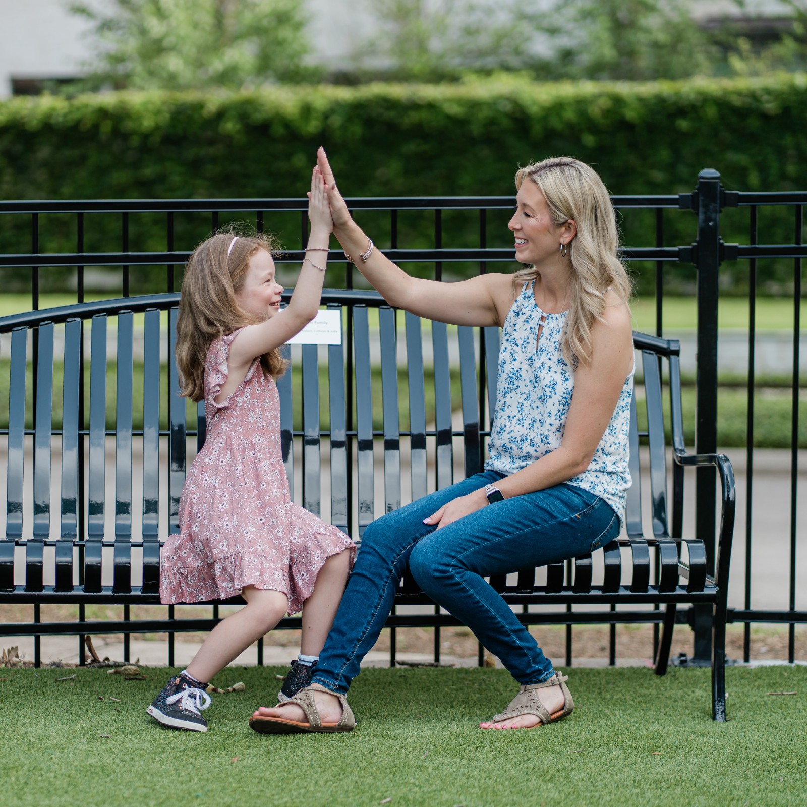 Mother and daughter high-five.